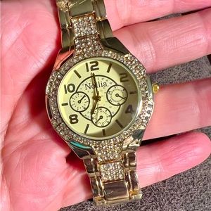 Nollia round; 39mm Strap: gold-tone stainless bracelet watch